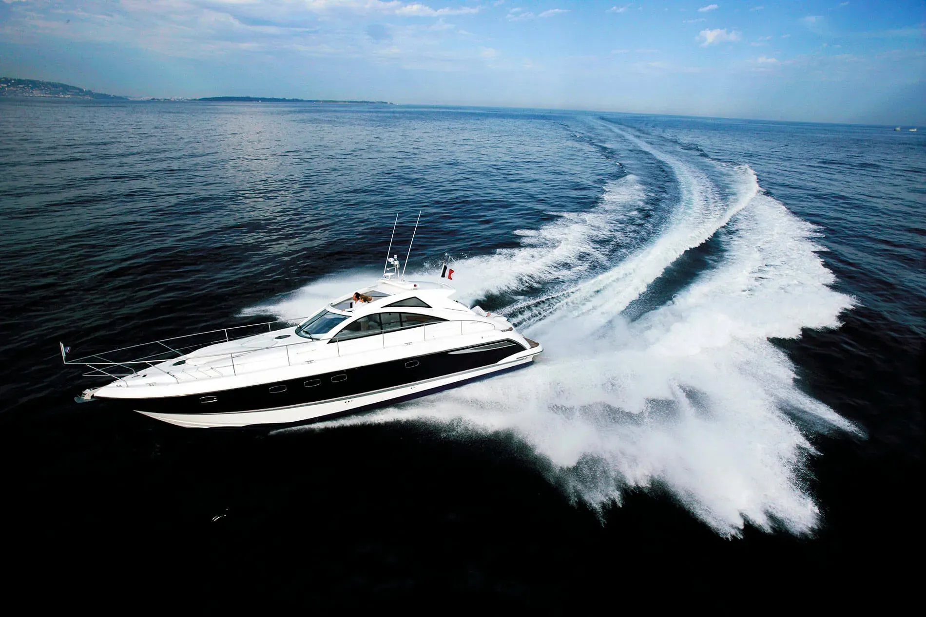 White luxury yacht sailing at sea