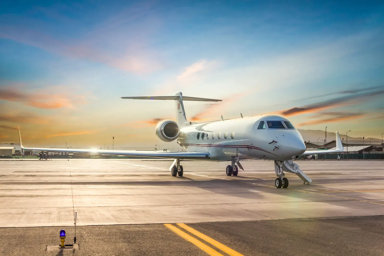 White private jet on the runway at sunset in Portugal