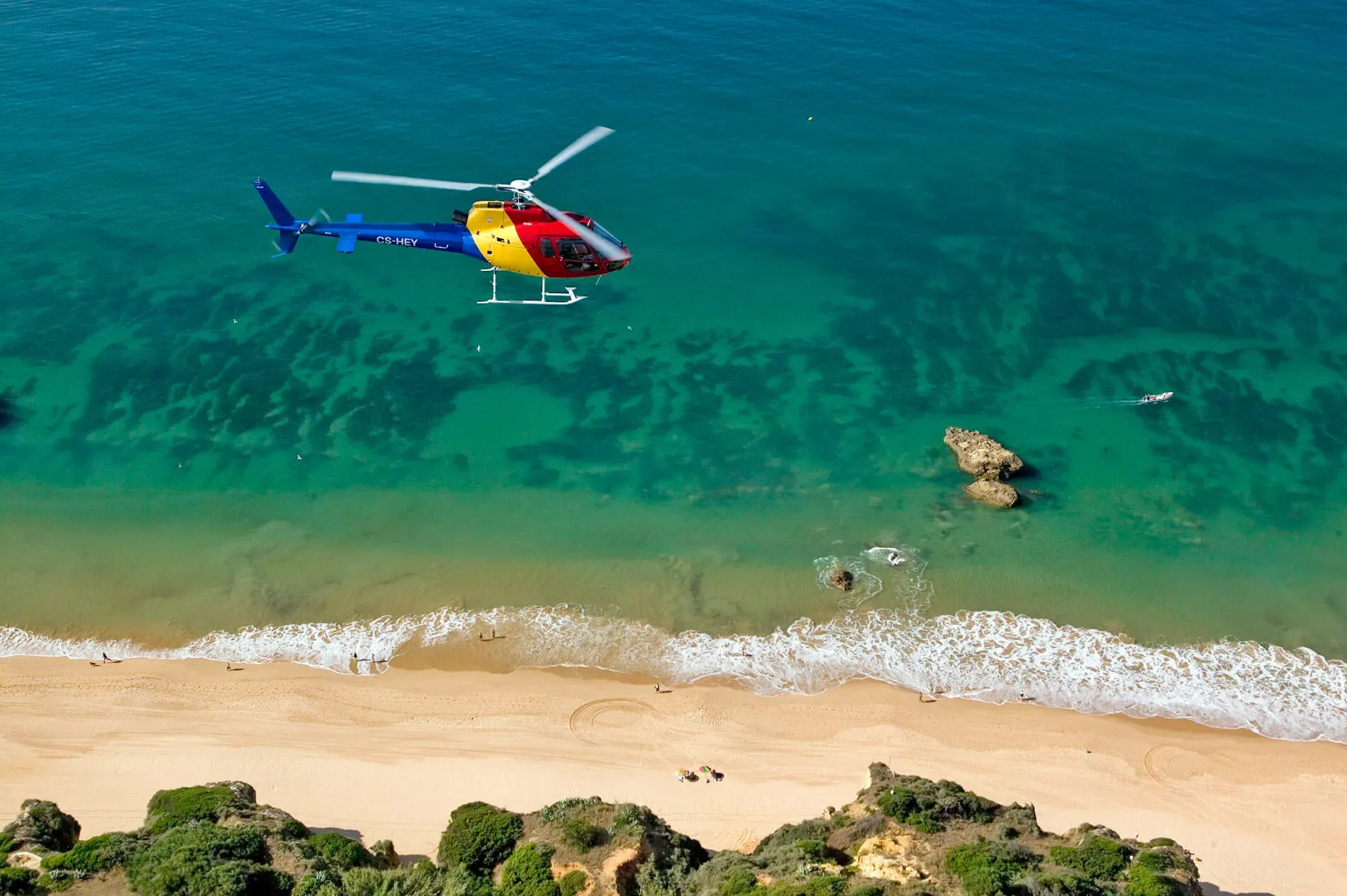 Helicopter flying over a beach in Portugal